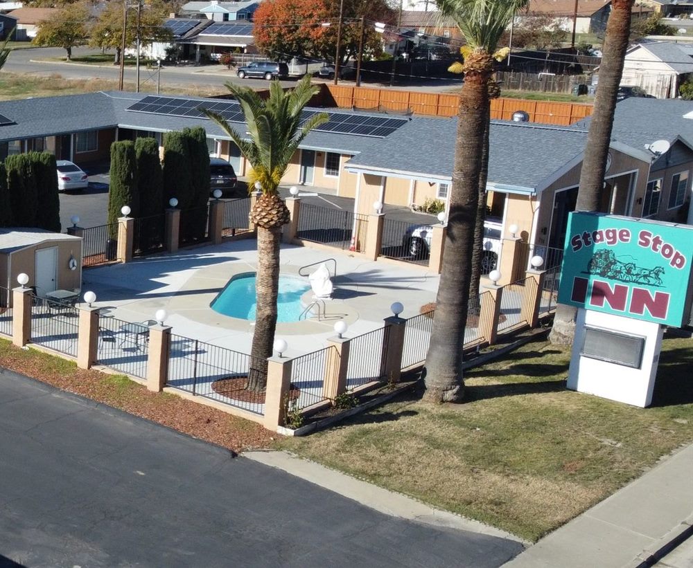 Stage Stop Inn in Williams, California — pool, palms, and Stage Stop Inn sign